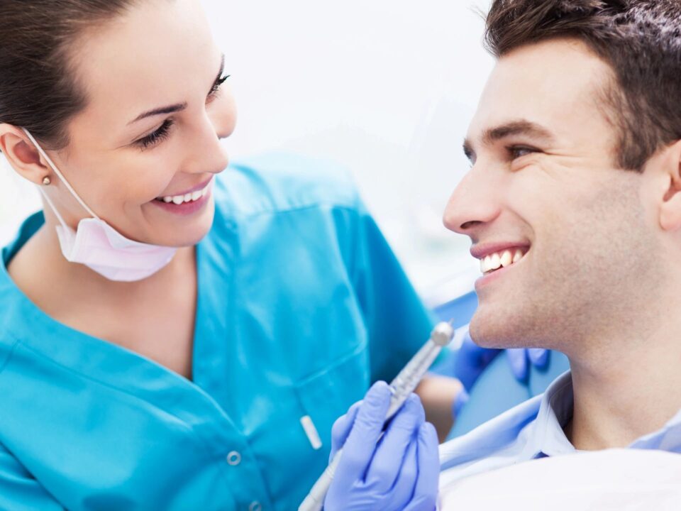 Dentist treating patient